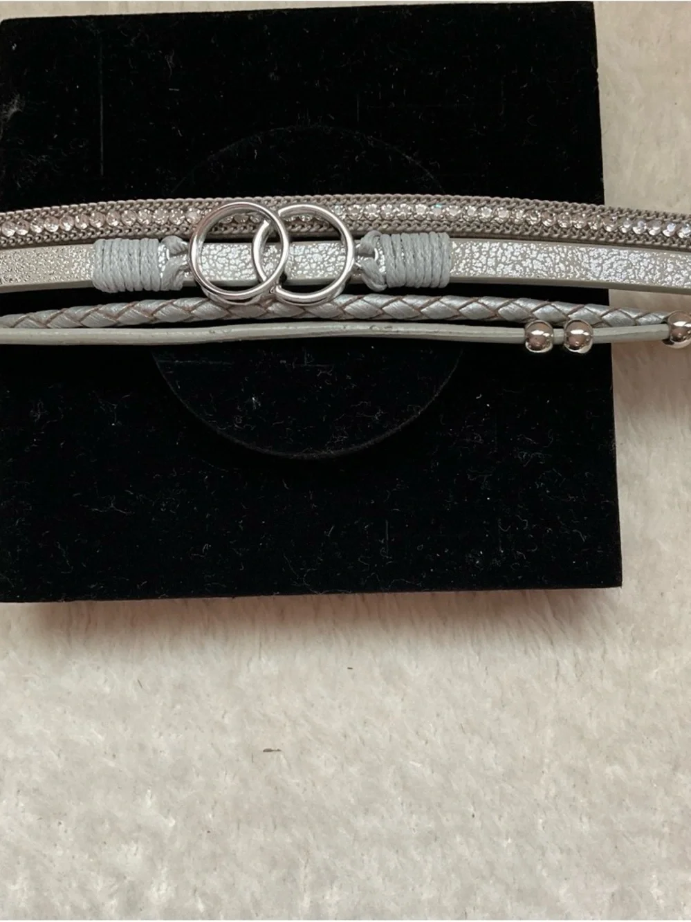 Silver Multi-Chain Bracelet with Interlocking Ring Accent